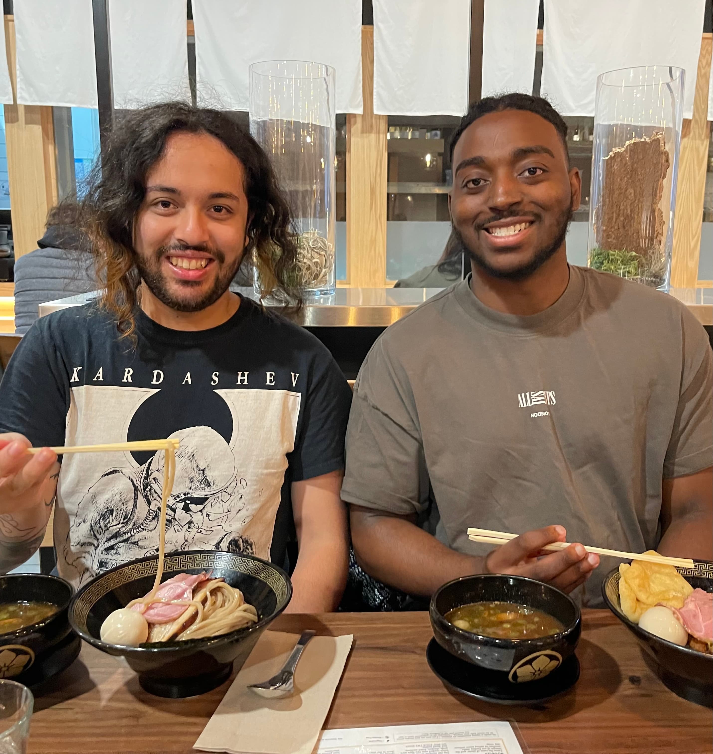 Brandon and Andrew working through product notes on a laptop